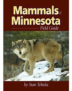 An image of the cover of the book Mammals of Minnesota Field Guide by Stan Tekiela featuring a photograph of a wolf.