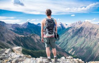 Hiker looks onto beautiful landscape