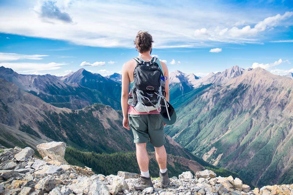 Hiker looks onto beautiful landscape