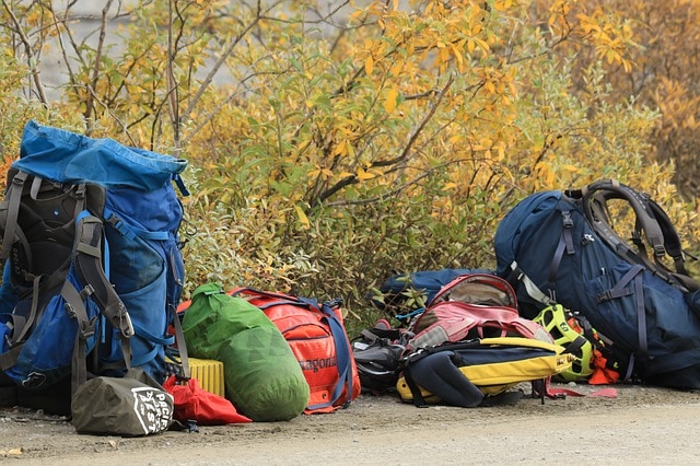 backpacks and camping bags on the road