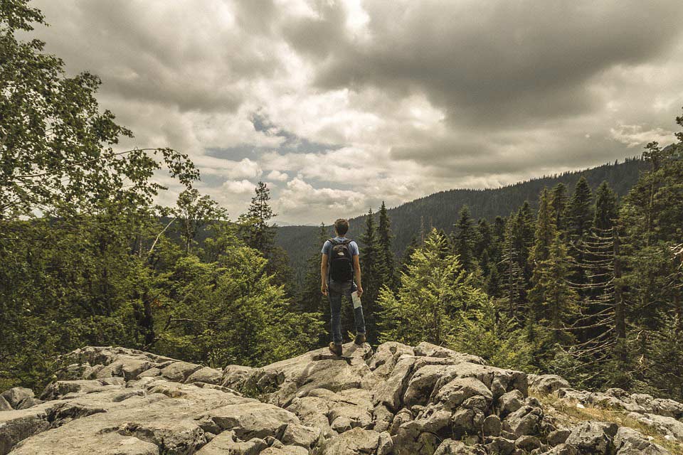 Hiker on rocky terrain in Montenegro