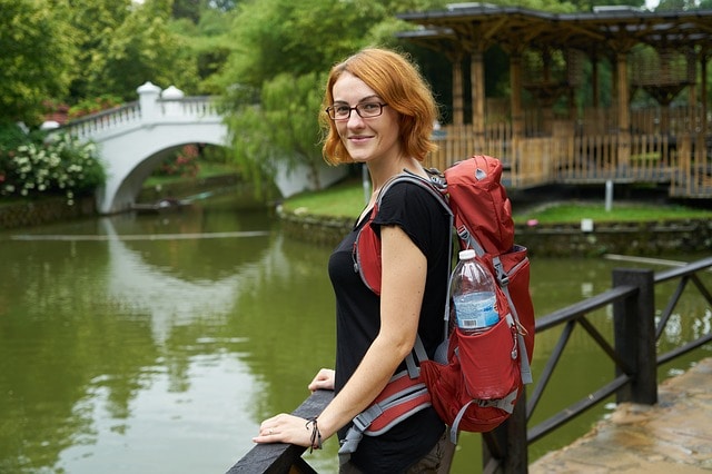 A woman with a big hiking backpack